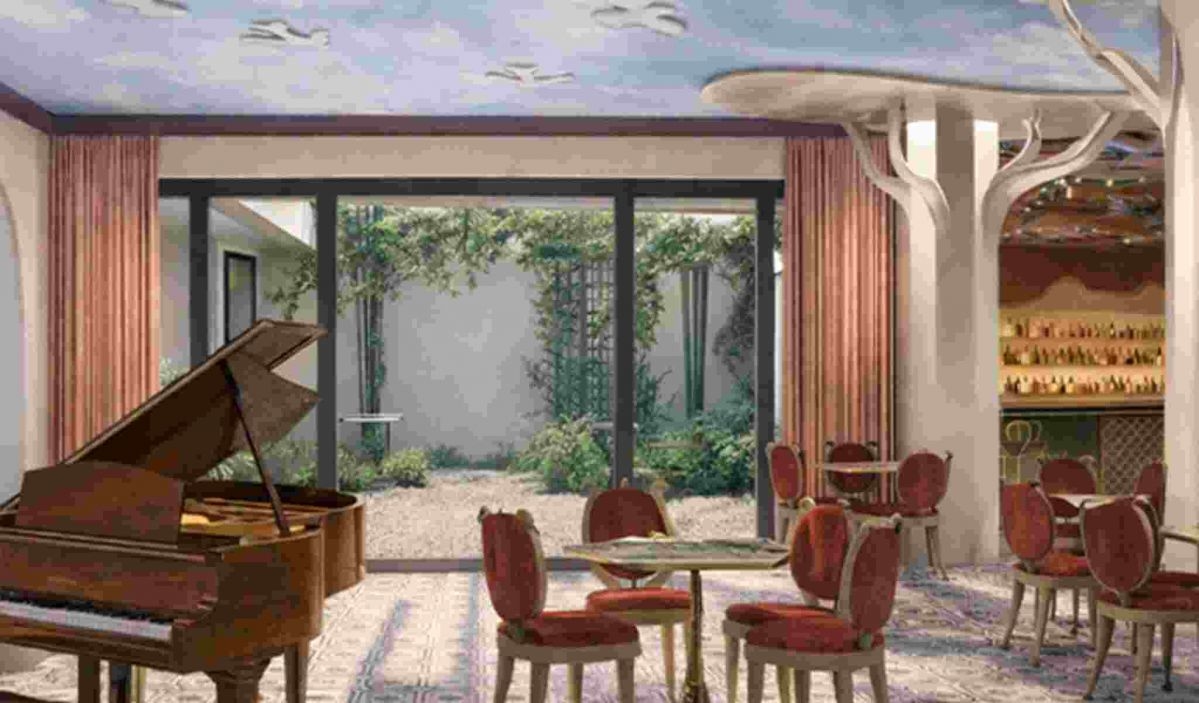 The stylish breakfast room bathed in natural light at the H&ocirc;tel Le Magnifique Paris